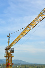 Fototapeta na wymiar Crane and building working progress, construction site