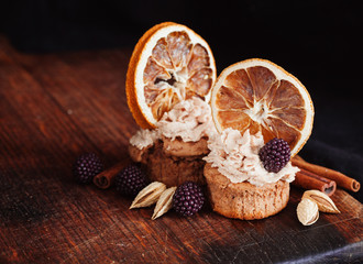 almond and orange cupcake with fresh blackberry