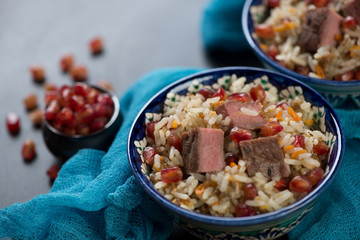 Close-up of georgian style pilaf with beef meat and pomegranate seeds