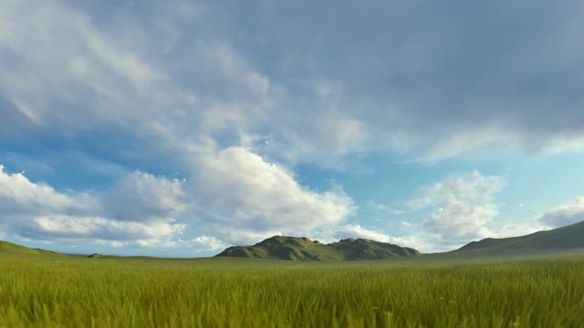 Green grass blowing in the wind with mountain range against timelapse stormy clouds
