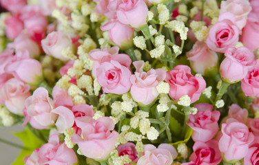 wedding bouquet with rose bush, Ranunculus asiaticus as a background