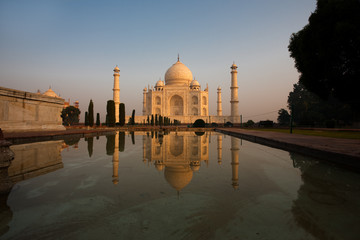 Side Fountain Taj Mahal at Sunrise with Reflection in Water