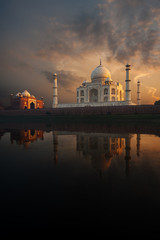 Fototapeta na wymiar Brilliant Sunset at Rear of Taj Mahal and Jawab along the Jamuna River in Agra, India