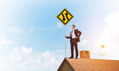 Mister boss on brick roof with sign in hands. Mixed media © adam121