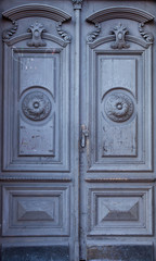 The vintage blue wooden  front  door of an old house