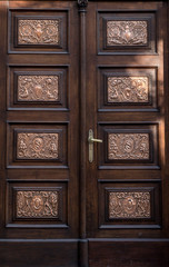 The vintage brown  wooden front door of an old house