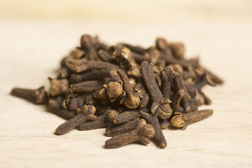 closeup of carnation, cloves on wooden background