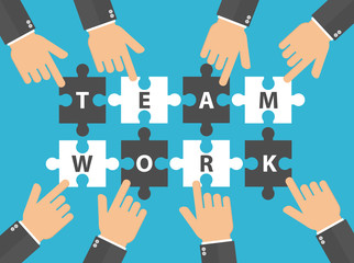 Hands pushing or putting puzzle pieces together with teamwork text on it. Teamwork concept. Hands pointing to puzzle pieces. Flat design