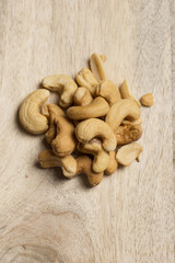 closeup of cashew nuts on wooden background