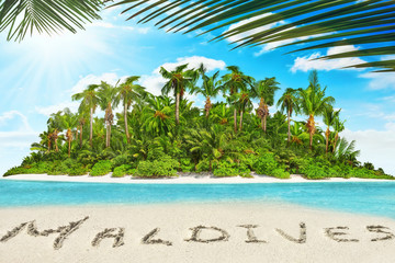 Fototapeta premium Whole tropical island within atoll in tropical Ocean and inscription 