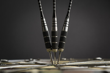 Three darts in the center of the target