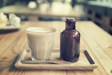 Coffee latte art in vintage filter