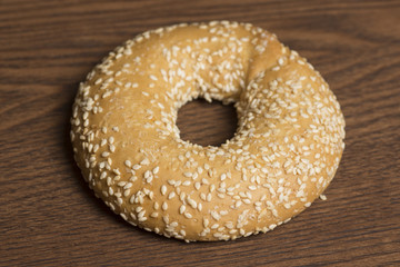 sesame bagels on wooden background