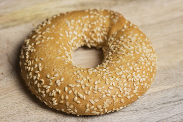 sesame bagels on wooden background