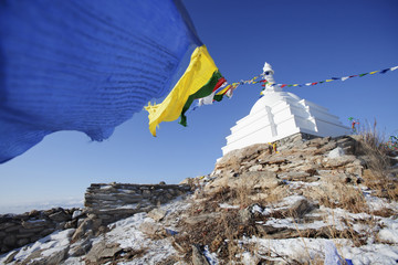 Buddhist stupa with colorful flags. Ogoi island. Baikal landmark
