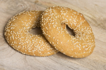 sesame bagels on wooden background