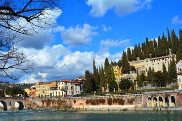 Panorama of the city of Verona with its Roman monuments, the ancient bridge and the Roman theater on the river, Italy.