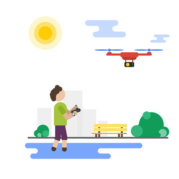 Flat boy playing with flying drone in the park