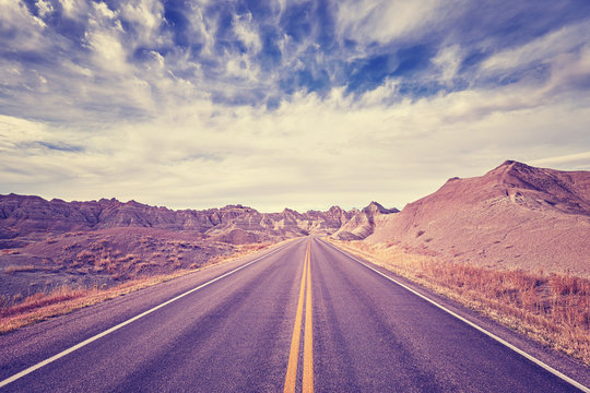 Vintage toned scenic desert highway, travel concept, USA