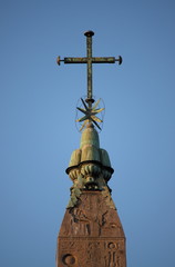 Fototapeta na wymiar Cross on top of the obelisk of Popolo Square in Rome, Italy