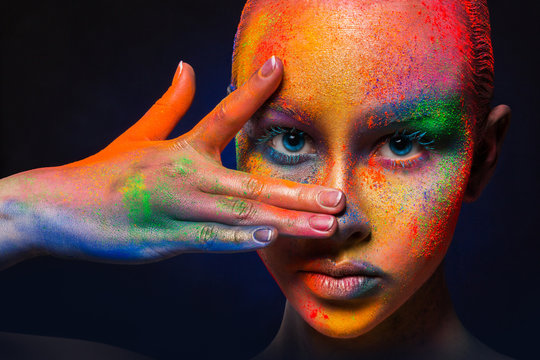 Model with colorful art make-up, close-up