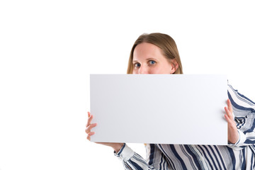 Fototapeta premium Smiling woman holding a blank white board to present something