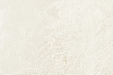 Closeup of white wedding lace with floral pattern