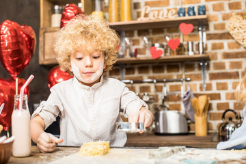 Boy making cookies