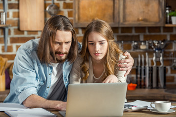 Couple using laptop