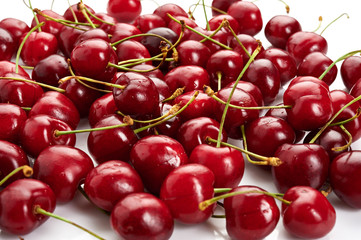 Fresh ripe cherries isolated on white background