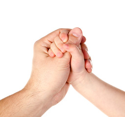 Child holds father's finger isolated