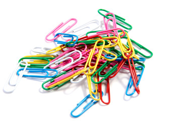 Bunch of colorful paper clips on white backgrpund