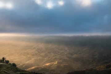 Naklejka na ściany i meble fog and cloud with sunrise shine to the mountain valley landscape, SAPA Vietnam.