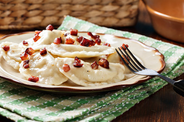 Dumplings with meat or cabbage and mushroom or cheese seasoned fried bacon