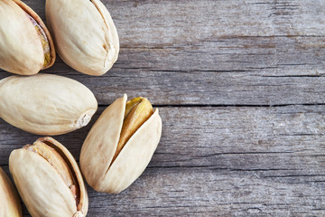 Pistachios on grey rustic wooden background. Top view with copy space