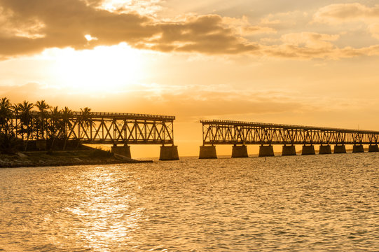 Remains of Bahia Honda railroad bridge in Florida Keys at sunset
