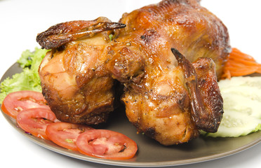 whole grilled chicken served with vegetable
