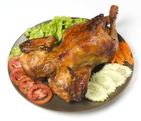 whole grilled chicken served with vegetable