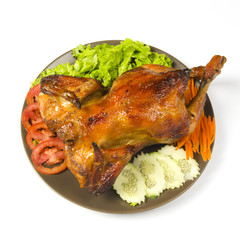 whole grilled chicken served with vegetable