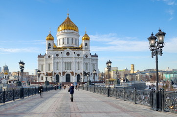 Moscow, Russia - February 16, 2017: The Cathedral of Christ the Savior and Patriarchal bridge a Sunny winter day