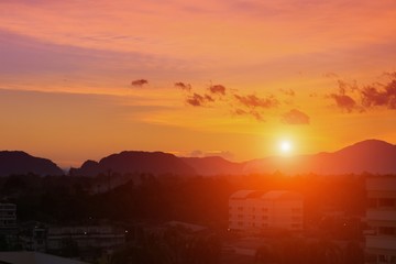 Obraz premium sky in sunset and motion cloud beautiful colorful evening nature landscape twilight time with city silhouette