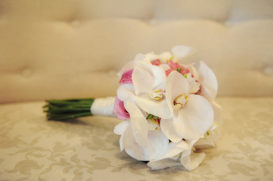 Bridal flower arrangement with white large orchids and pink roses