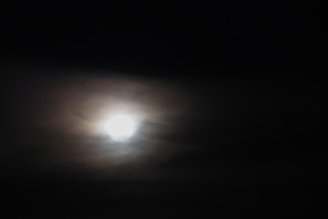 Full moon beautiful over dark black sky at have raincloud in night