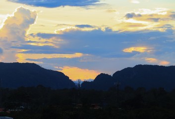 sky in sunset and raincloud  colorful twilight time in city  with mountain silhouette, art beautiful in nature