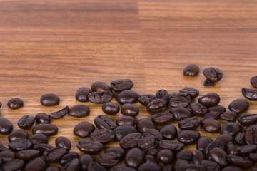 Coffee beans on wood background