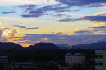 sky in sunset and raincloud  colorful twilight time in city  with mountain silhouette, art beautiful in nature