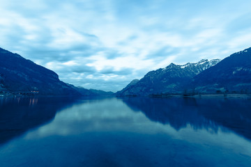 Fototapeta na wymiar Mountain lake landscape in the evening. Long exposure. Blue Hour