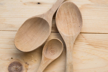 spoons on wood background