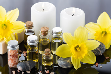 Obraz na płótnie Canvas Aroma oil for aromatherapy,candle,flowers,stone