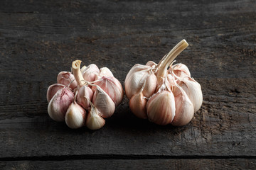 Garlic on the background of a dark wooden table